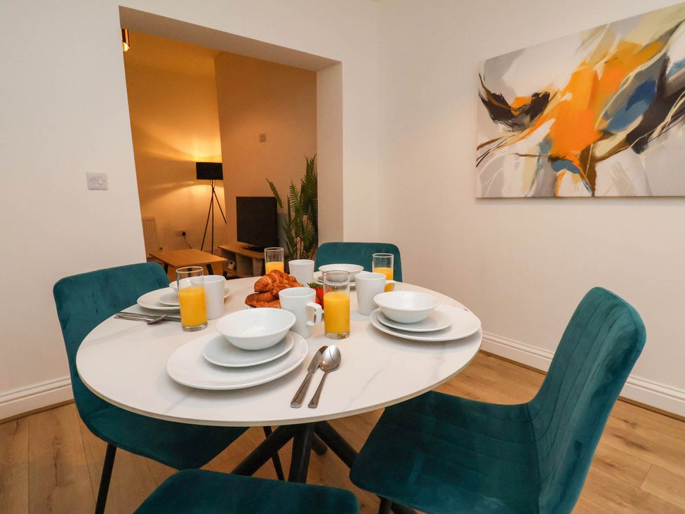 A dining room with a table set for breakfast at Holmwood