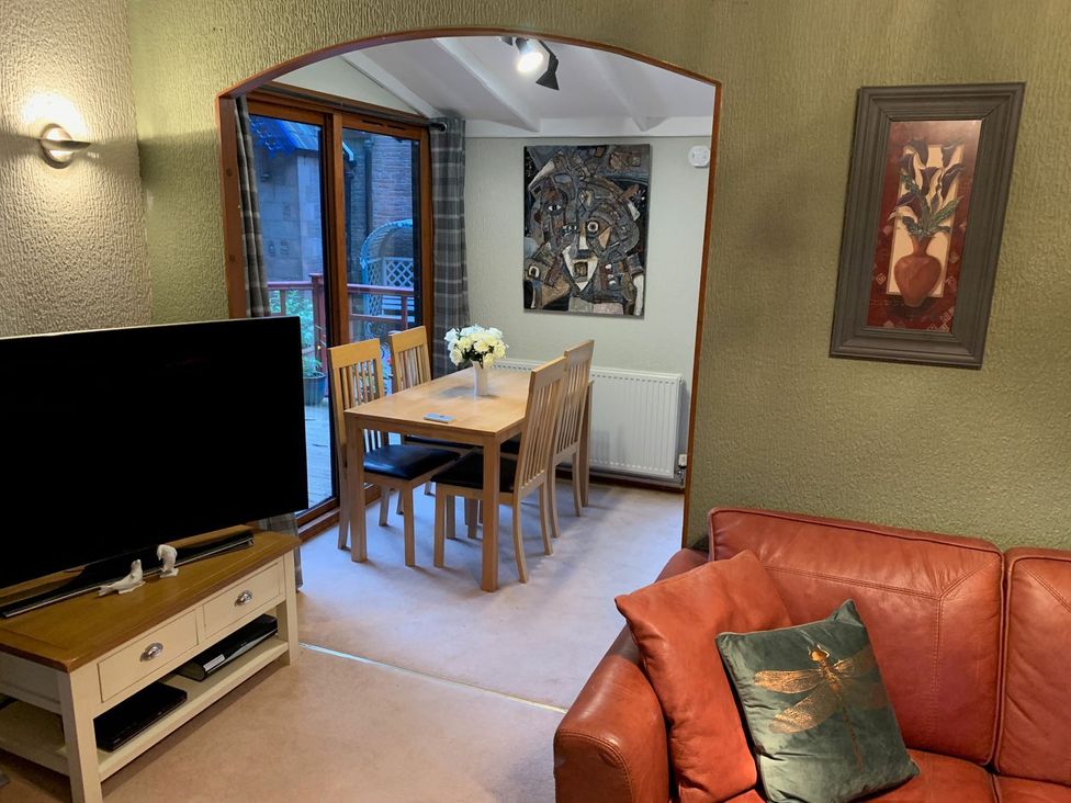 A dining room with a table and chairs at The Hermitage in Penrith