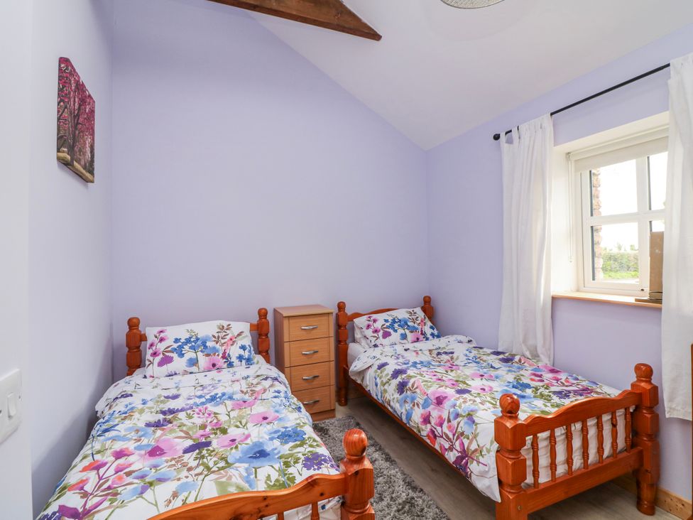 A bedroom with two beds and a window at The Stable in Dublin