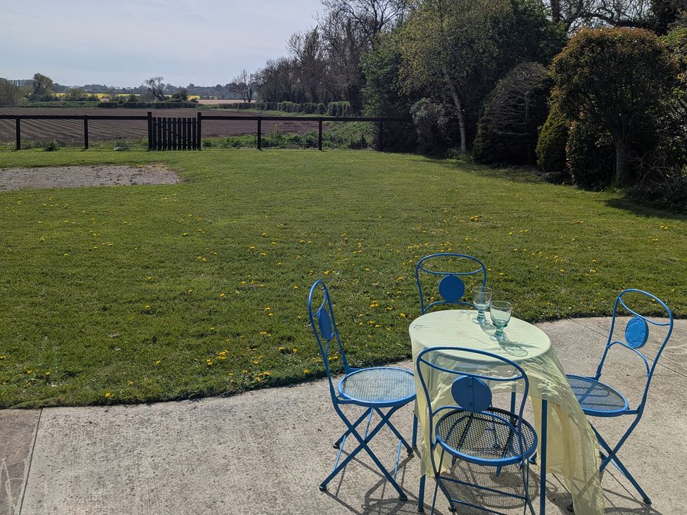 A garden with a table and chairs at The Stable, Swords, County Dublin