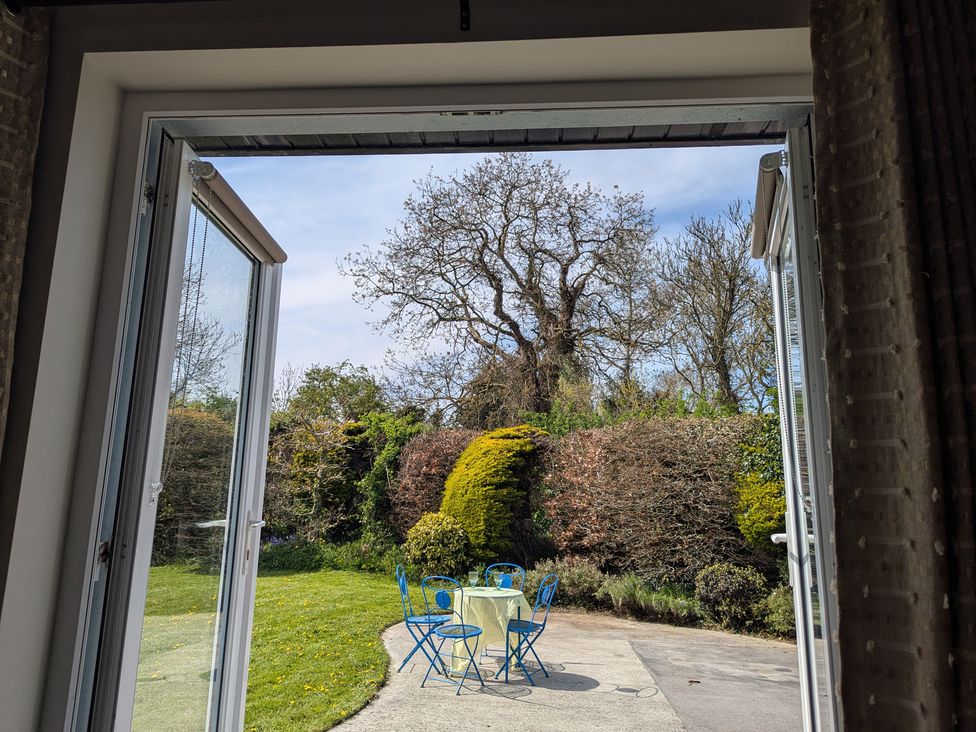 An outdoor area with a table and chairs at The Stable in Swords, County Dublin