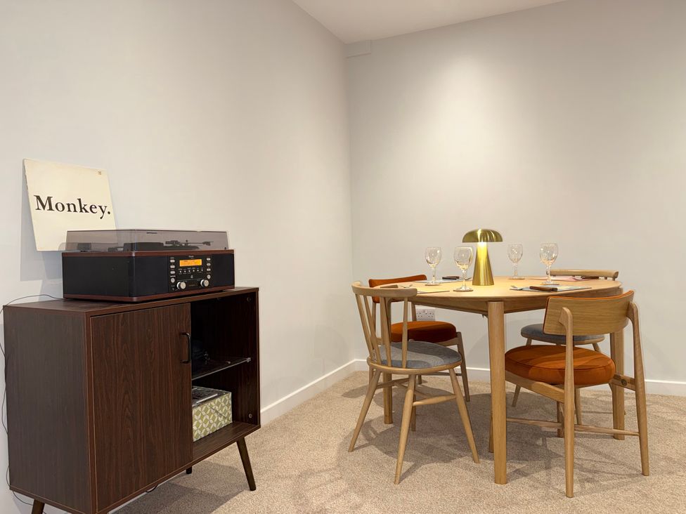 A dining room with a table and chairs at Amber Rose in Berwick-upon-Tweed