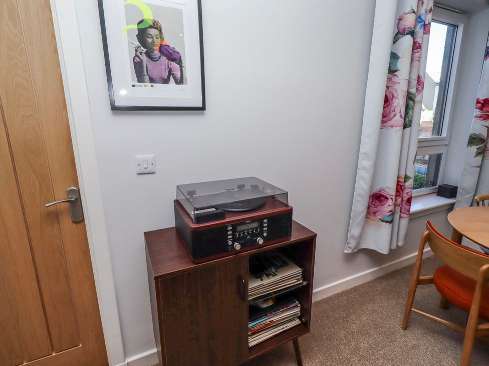 A snug with a record player and vinyl records at Amber Rose in Berwick-Upon-Tweed