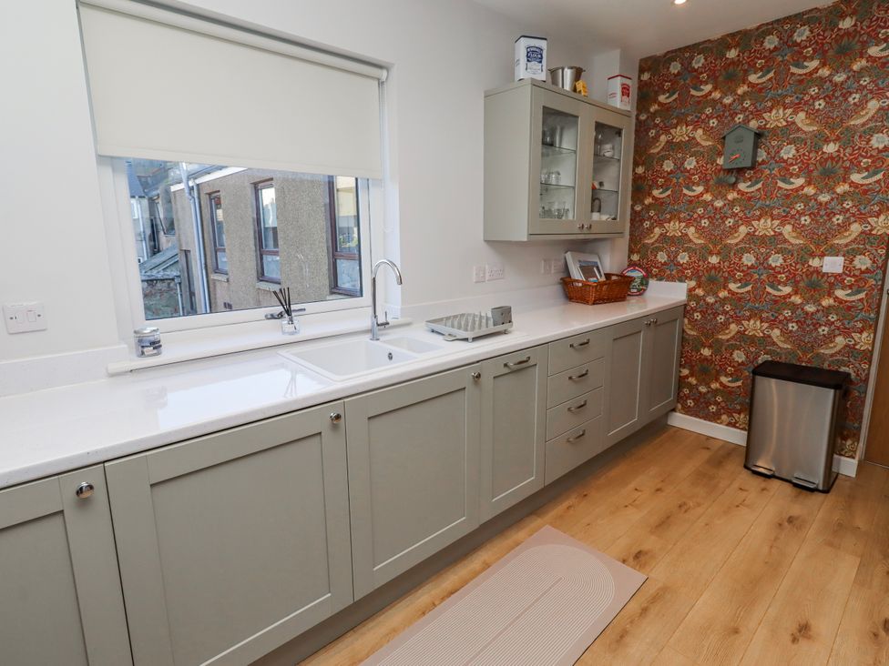 A kitchen with sink and cabinets at Amber Rose in Berwick-Upon-Tweed