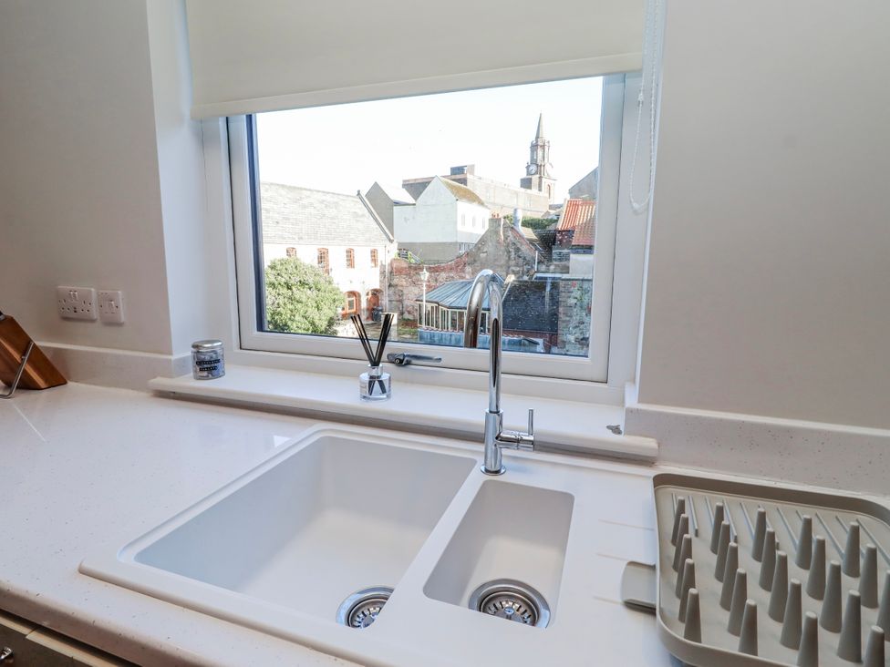 A kitchen with a sink and window at Amber Rose in Berwick-Upon-Tweed