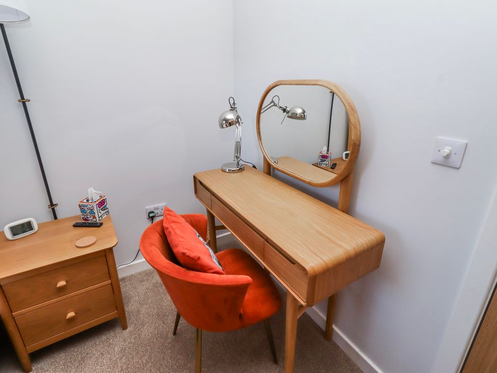 A bedroom with a desk and chair at Amber Rose in Berwick-Upon-Tweed