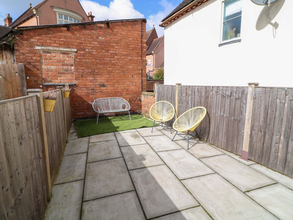 An outdoor area with paving stones and seating at Jolly Cottage Derby