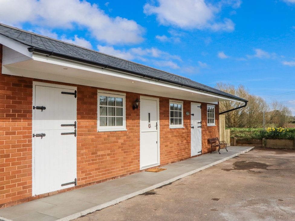 An outdoor view of a brick building with doors and windows at Shamrock in Exeter