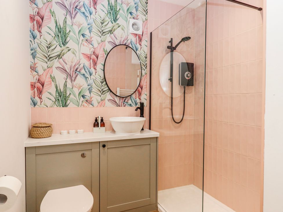 A bathroom with a shower and sink at Shamrock in Exeter