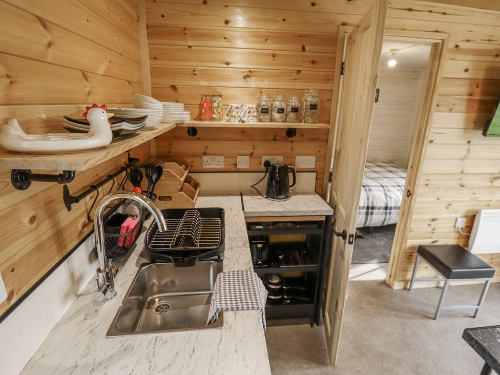 A kitchen with a sink and kettle at Mardi Gras in Wisbech