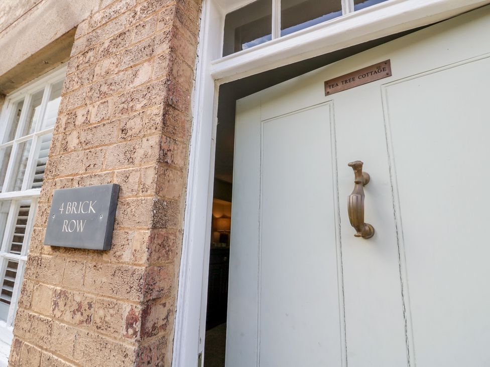 An entryway with a door and house number at Tea Tree Cottage in Chipping Campden