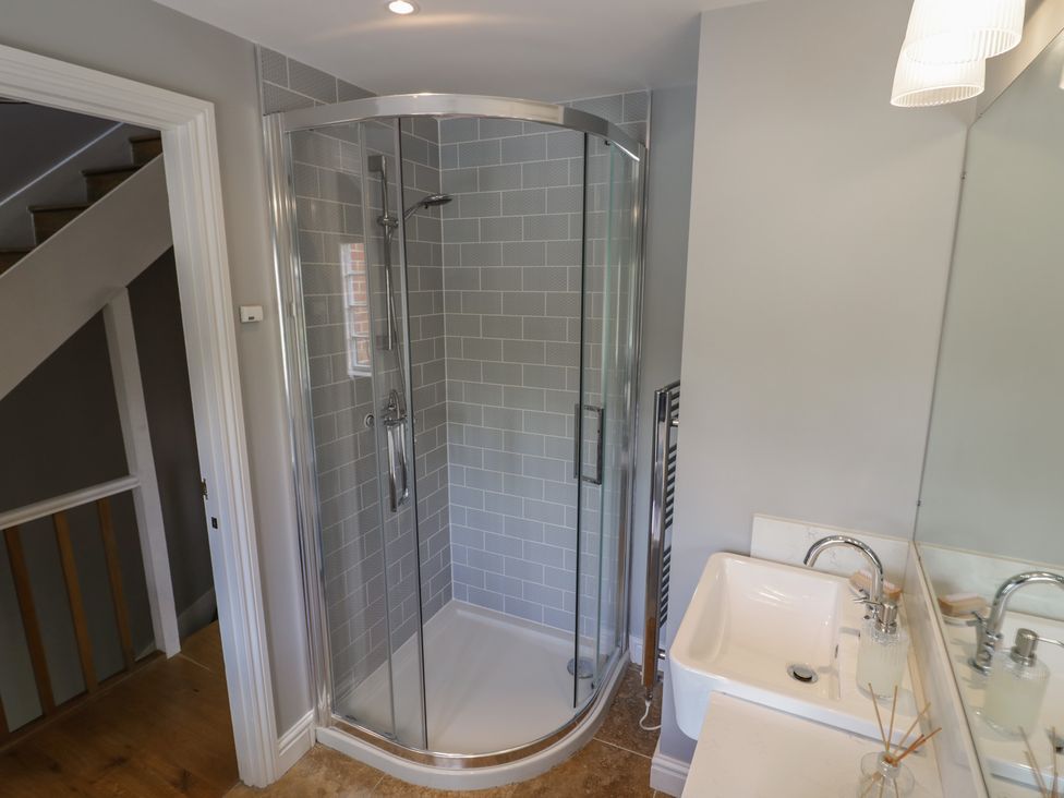 A bathroom with a shower and sink at Tea Tree Cottage in Chipping Campden