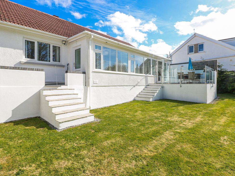 An outdoor view of a house with steps and a patio at Moonraker in Saundersfoot