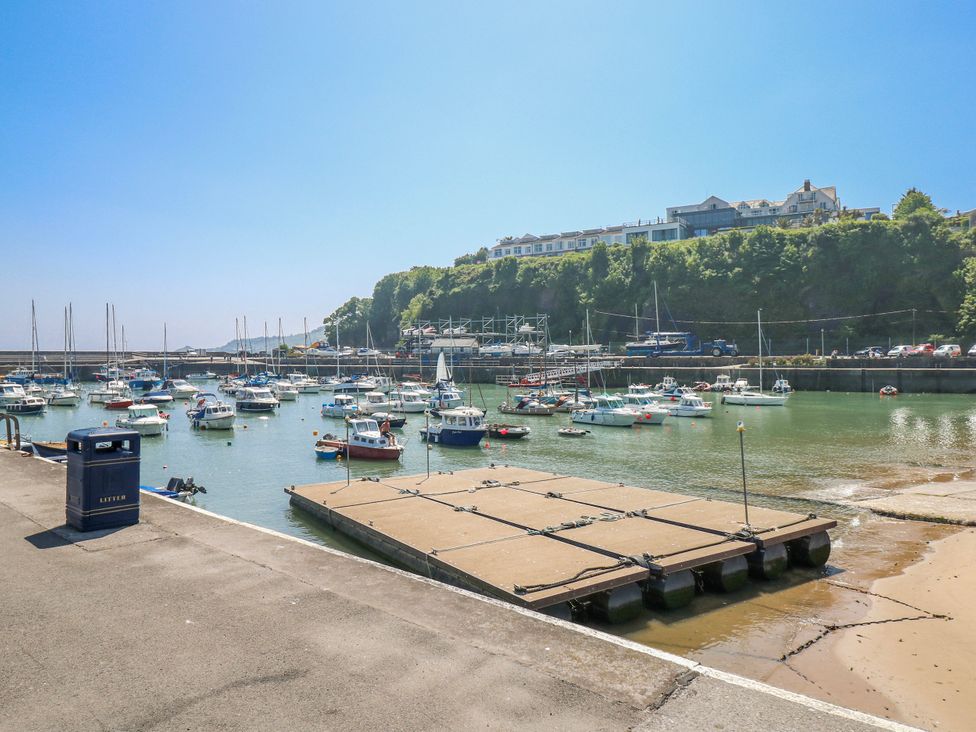 A harbor with boats moored in the water at Moonraker in Saundersfoot