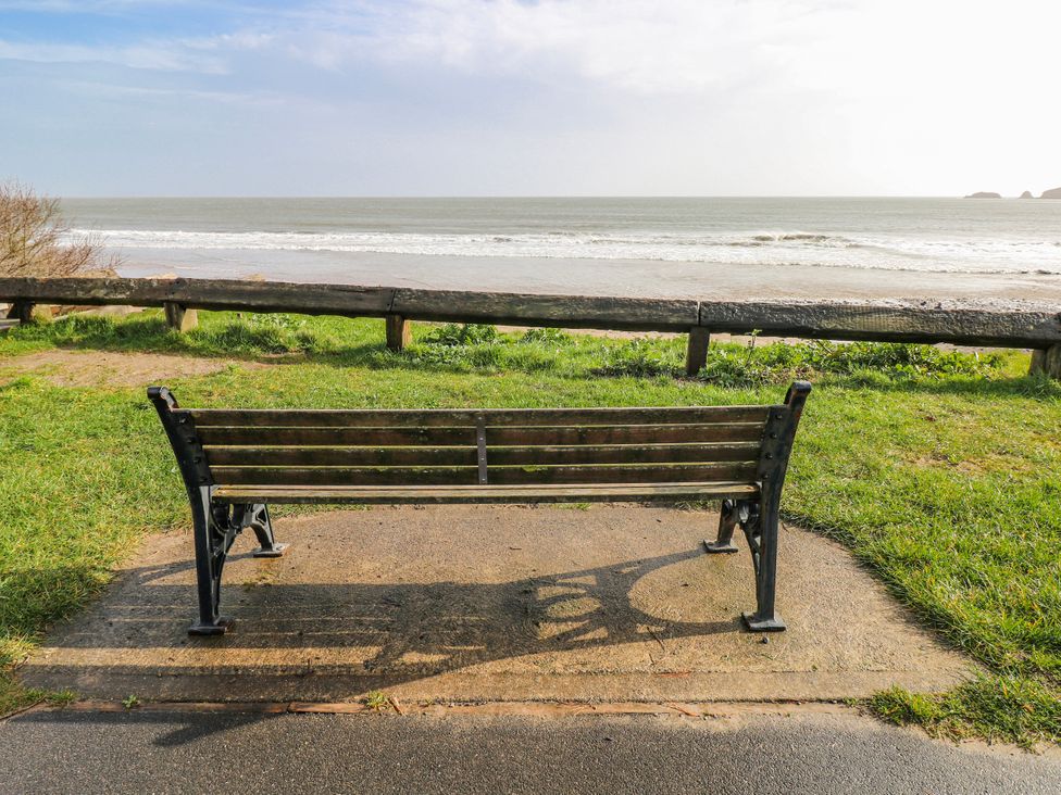 A bench facing the sea at Moonraker in Saundersfoot