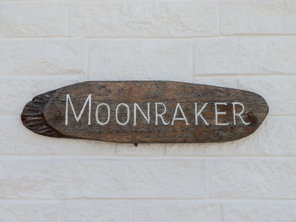 A wooden sign displaying the name Moonraker