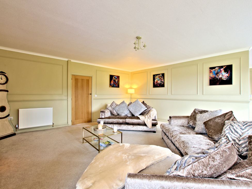 A living room with a sofa and coffee table at River View Cottage in Hanlith near Malham