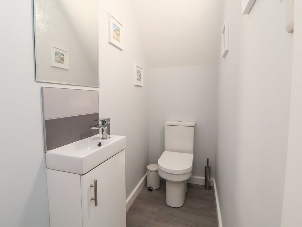 A bathroom with a sink and toilet at Mike’s Place in Rhyl