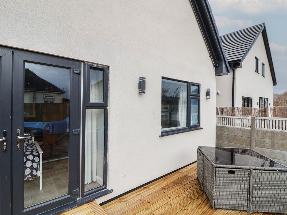 An outdoor area with a door and window at Mike’s Place in Rhyl