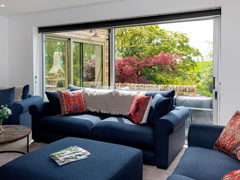 A living room with a view of trees at 2 The Croft in Skipton