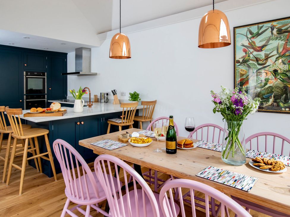 A dining room with a table set for a meal at 2 The Croft in Skipton