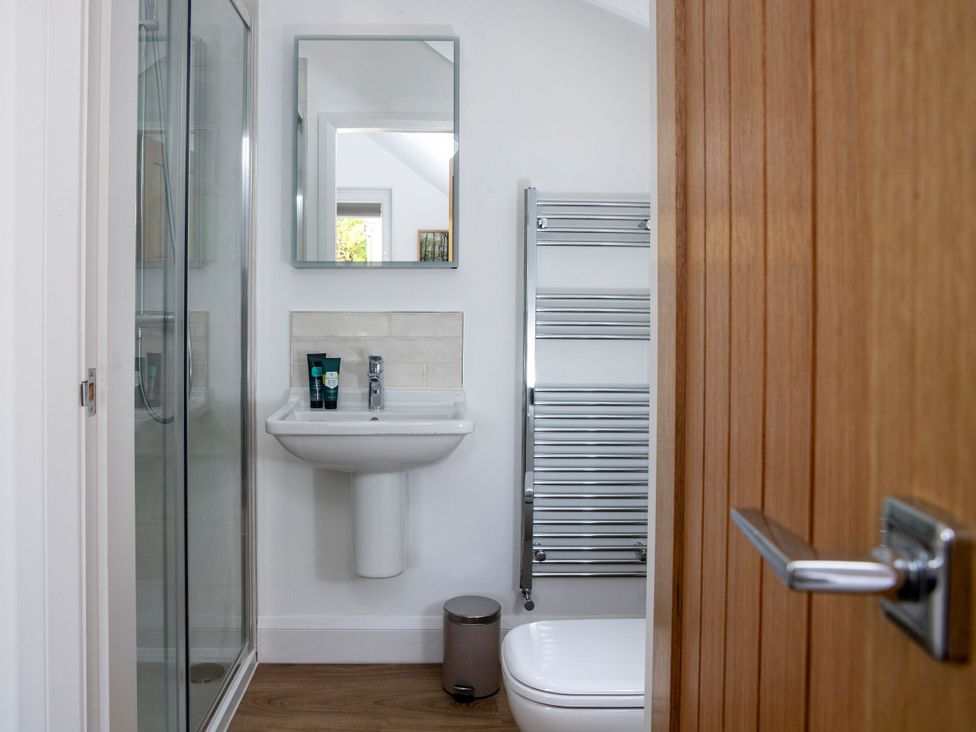 A bathroom with a sink and shower at 2 The Croft in Skipton