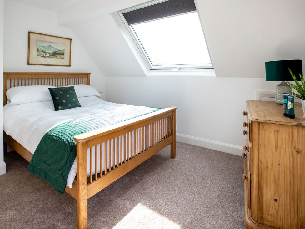 A bedroom with a bed and dresser at 2 The Croft in Skipton