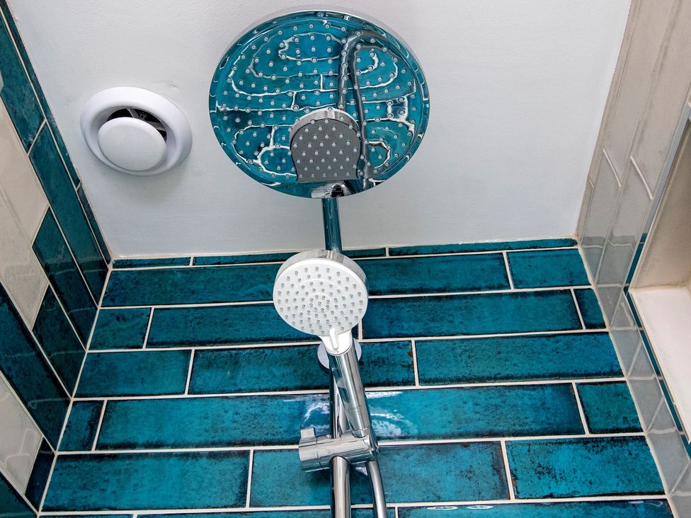 A shower with a rain shower head and handheld shower at 2 The Croft in Skipton