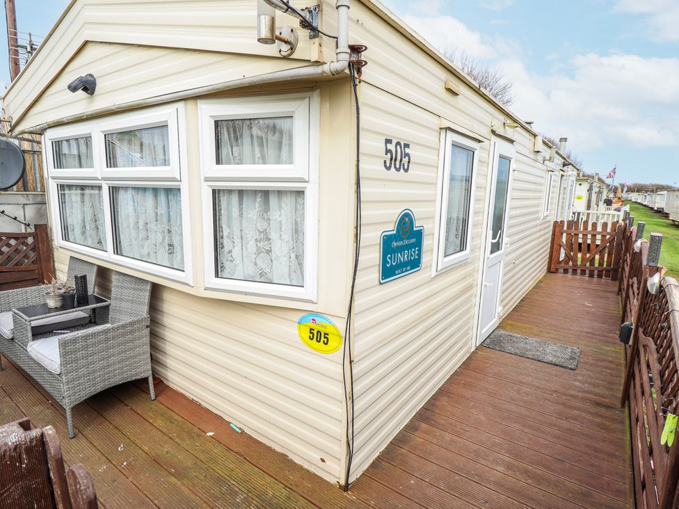 A caravan with outdoor seating at The Promenade in Skegness