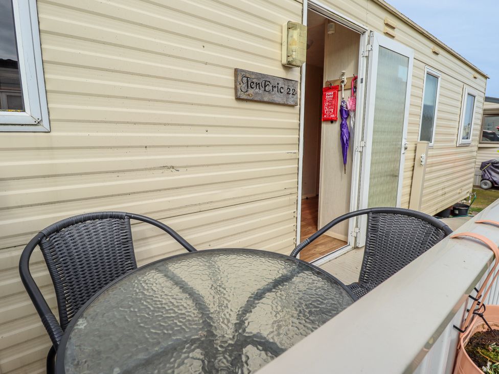 An outdoor area with a table and chairs at Seaview in Skegness