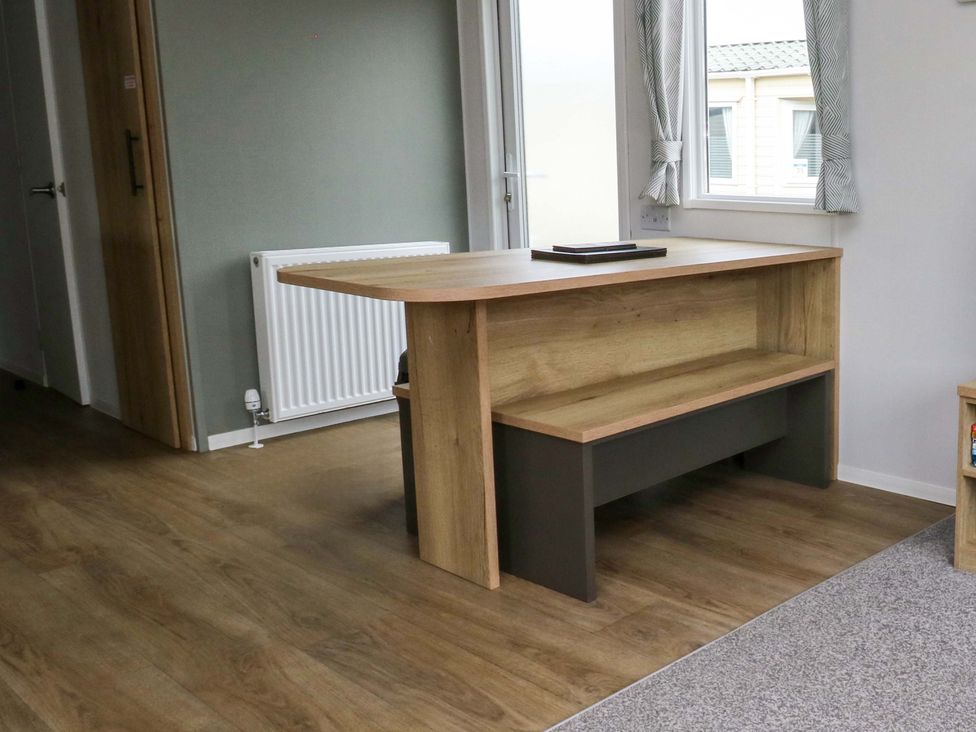 An office with a wooden table near a window at Valley 36 in Kingsbridge