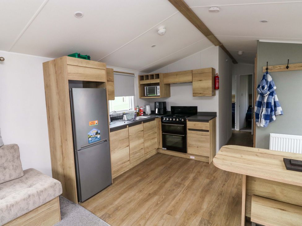 A kitchen with appliances and cabinets at Valley 36 in Kingsbridge