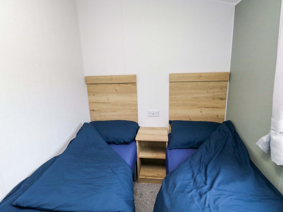 A bedroom with two beds and a nightstand at Valley 36 in Kingsbridge
