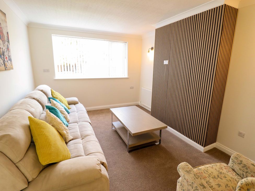 A living room with a sofa and coffee table at 271 Wragby Road in Lincoln