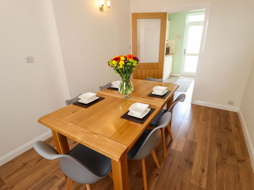 A dining room with a table and chairs at 271 Wragby Road in Lincoln