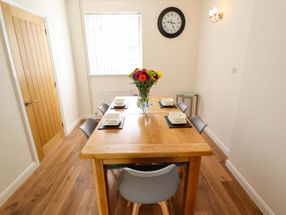 A dining room with a table and chairs at 271 Wragby Road in Lincoln