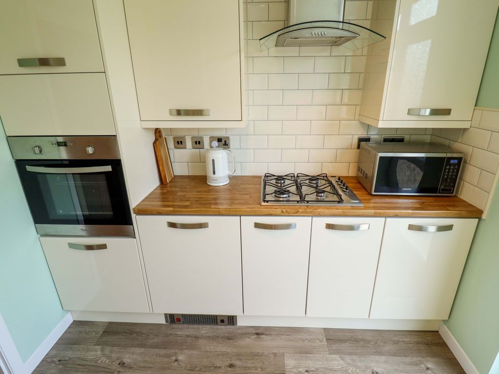 A kitchen with appliances and cabinetry at 271 Wragby Road in Lincoln