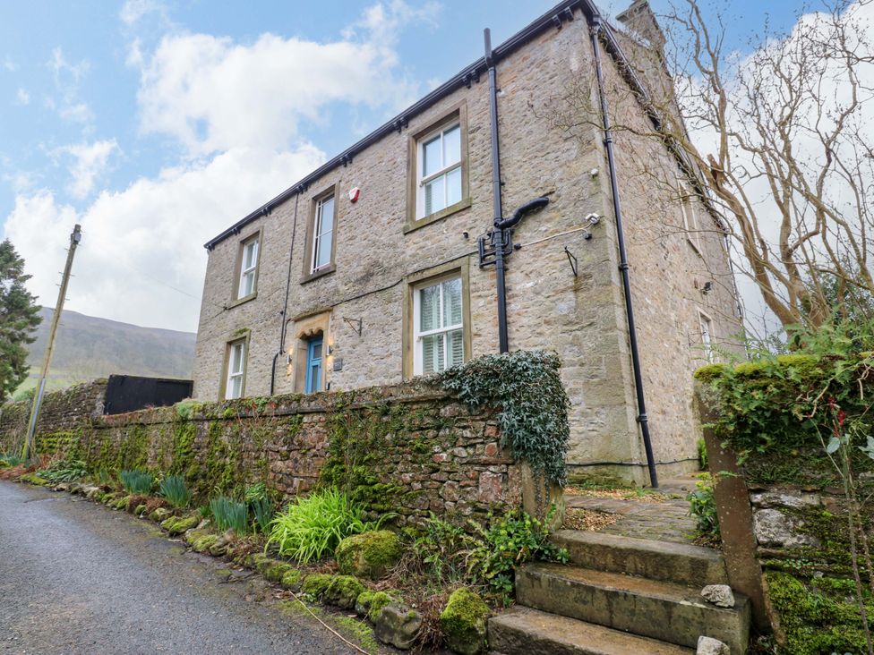 A house with windows and a door at Langcliffe House in Kettlewell