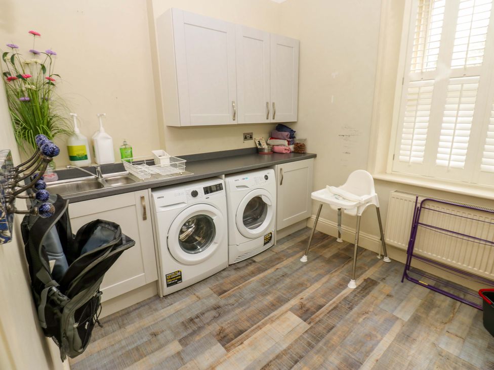 A laundry room with washing machine and dryer at Langcliffe House Kettlewell