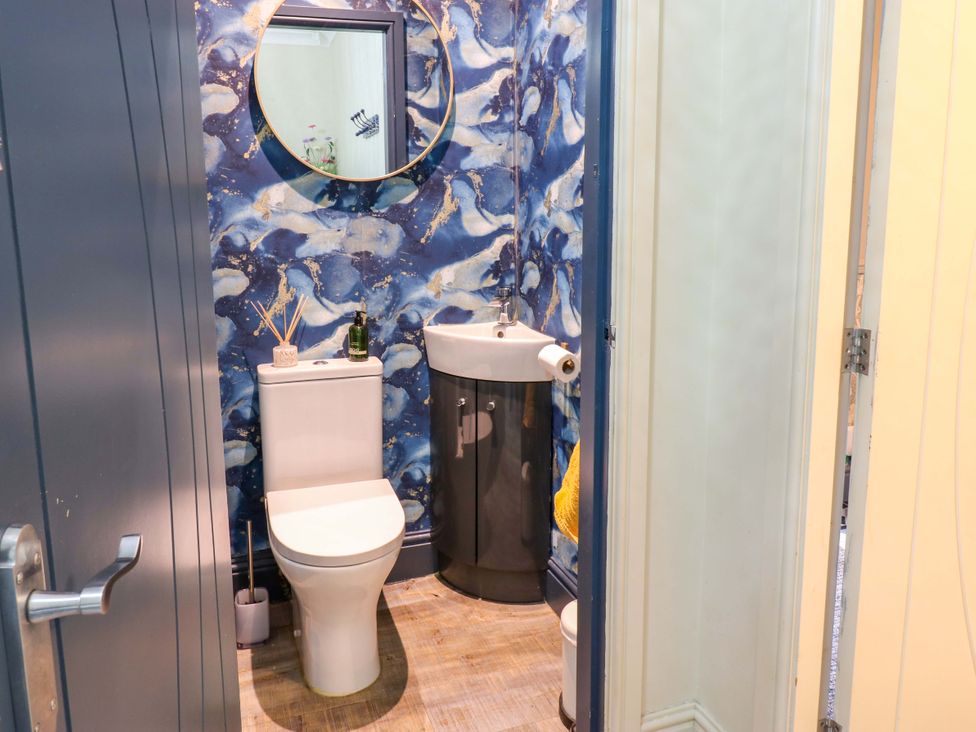 A bathroom with toilet and sink at Langcliffe House in Kettlewell