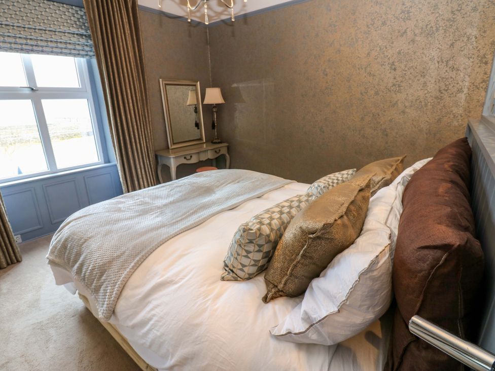 A bedroom with a bed and window at Langcliffe House Kettlewell