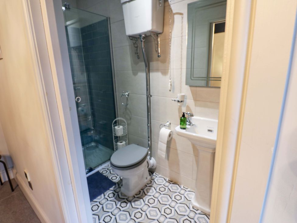 A bathroom with a toilet and sink at Langcliffe House Kettlewell