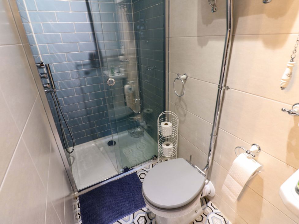 A bathroom with a shower and toilet at Langcliffe House in Kettlewell