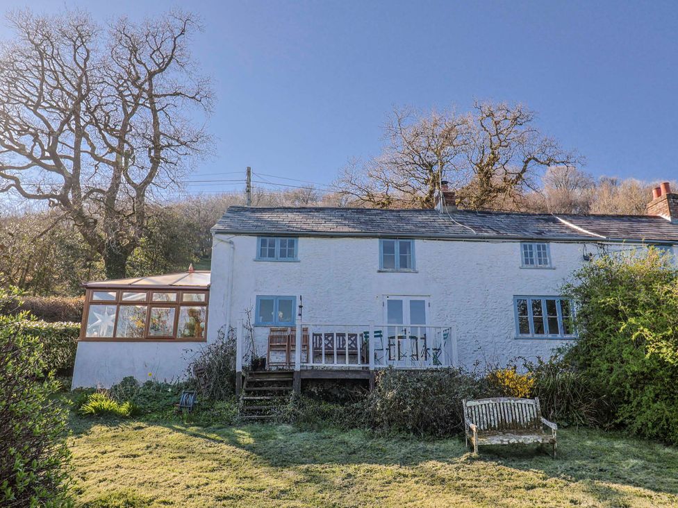 A house with a garden and deck area at 2 Oak Tree Cottages Marshwood Nr. Hawkchurch