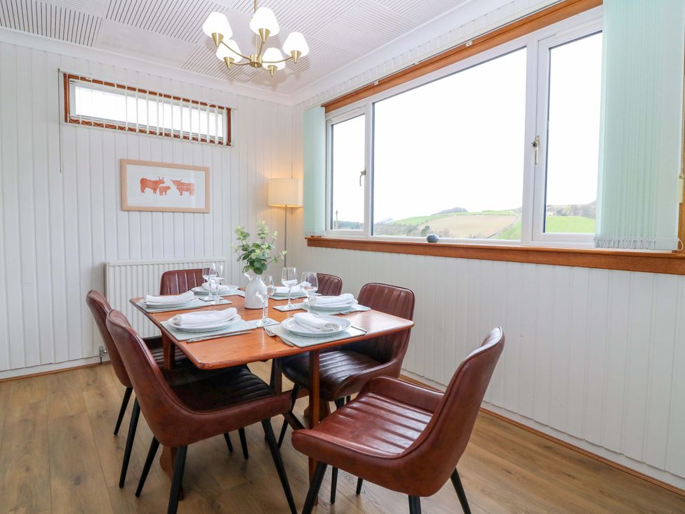 A dining room with a table set for dinner at Parkhill in Dairsie