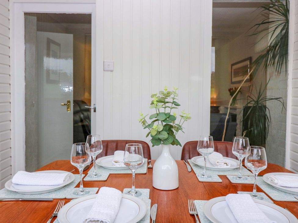 A dining room with a table set for a meal at Parkhill in Dairsie