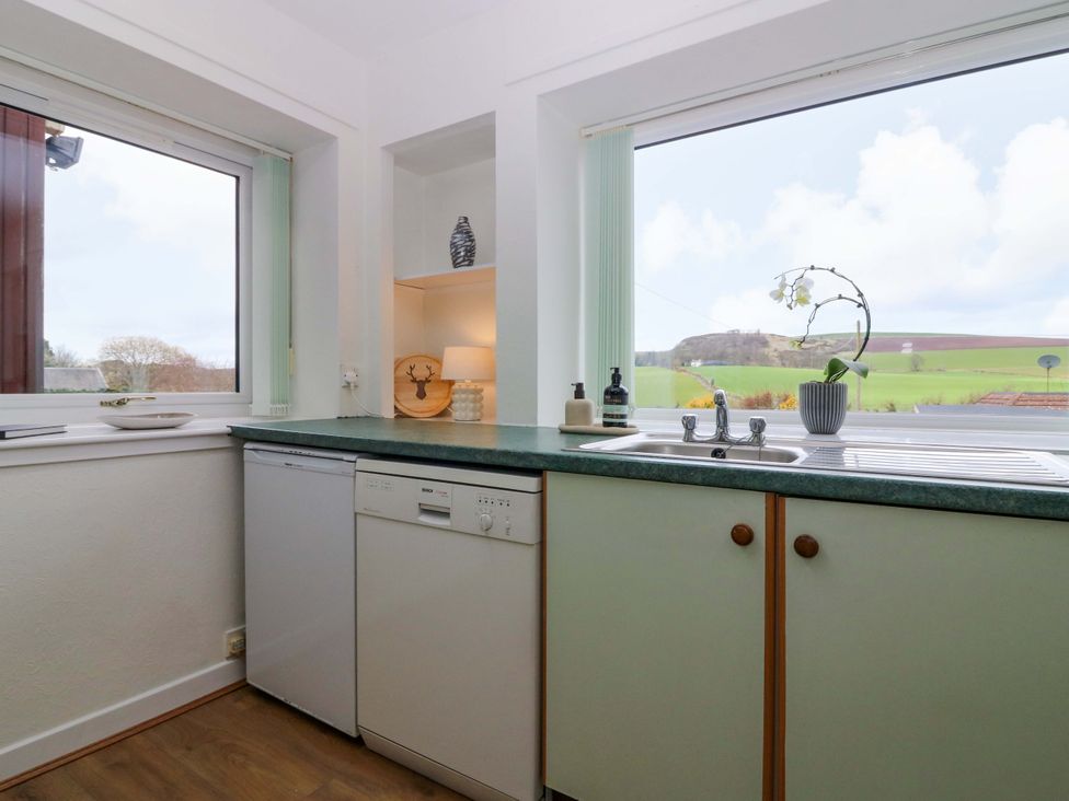 A kitchen with a sink and dishwasher at Parkhill in Dairsie