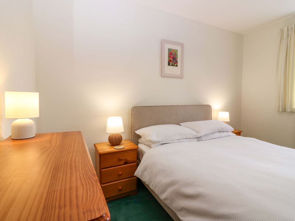 A bedroom with a bed and nightstands at Parkhill in Dairsie