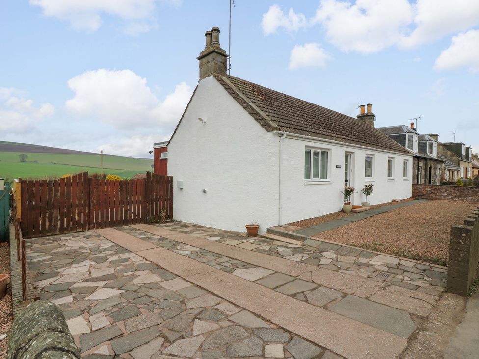 A house with a driveway and garden at Parkhill in Dairsie