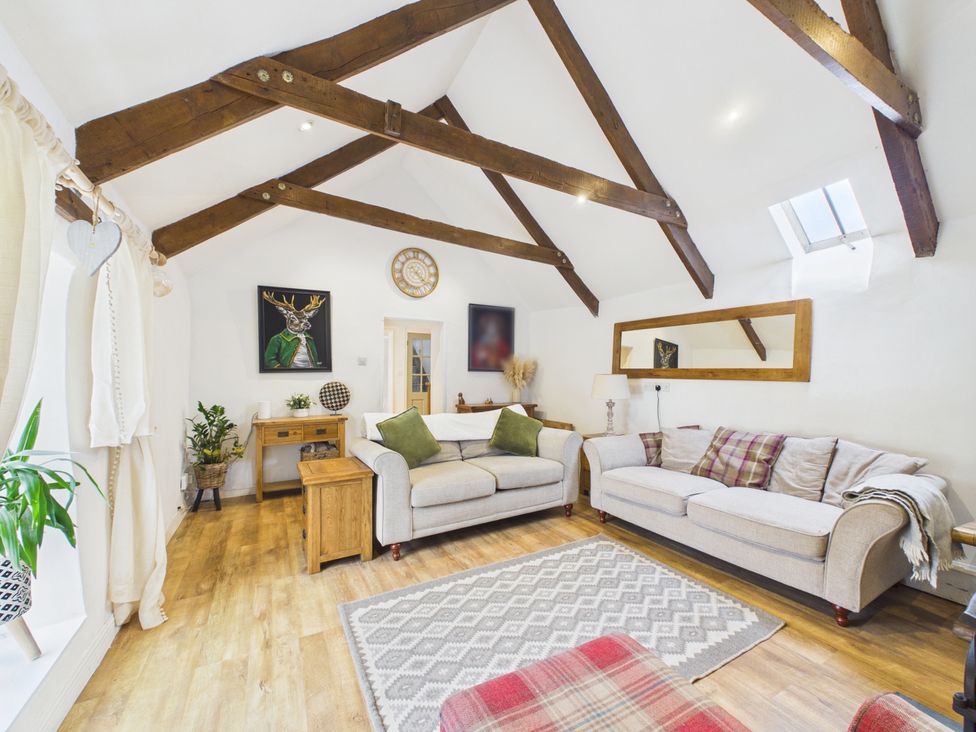 A living room with a sofa and coffee table at Tor Farm Advent near Camelford
